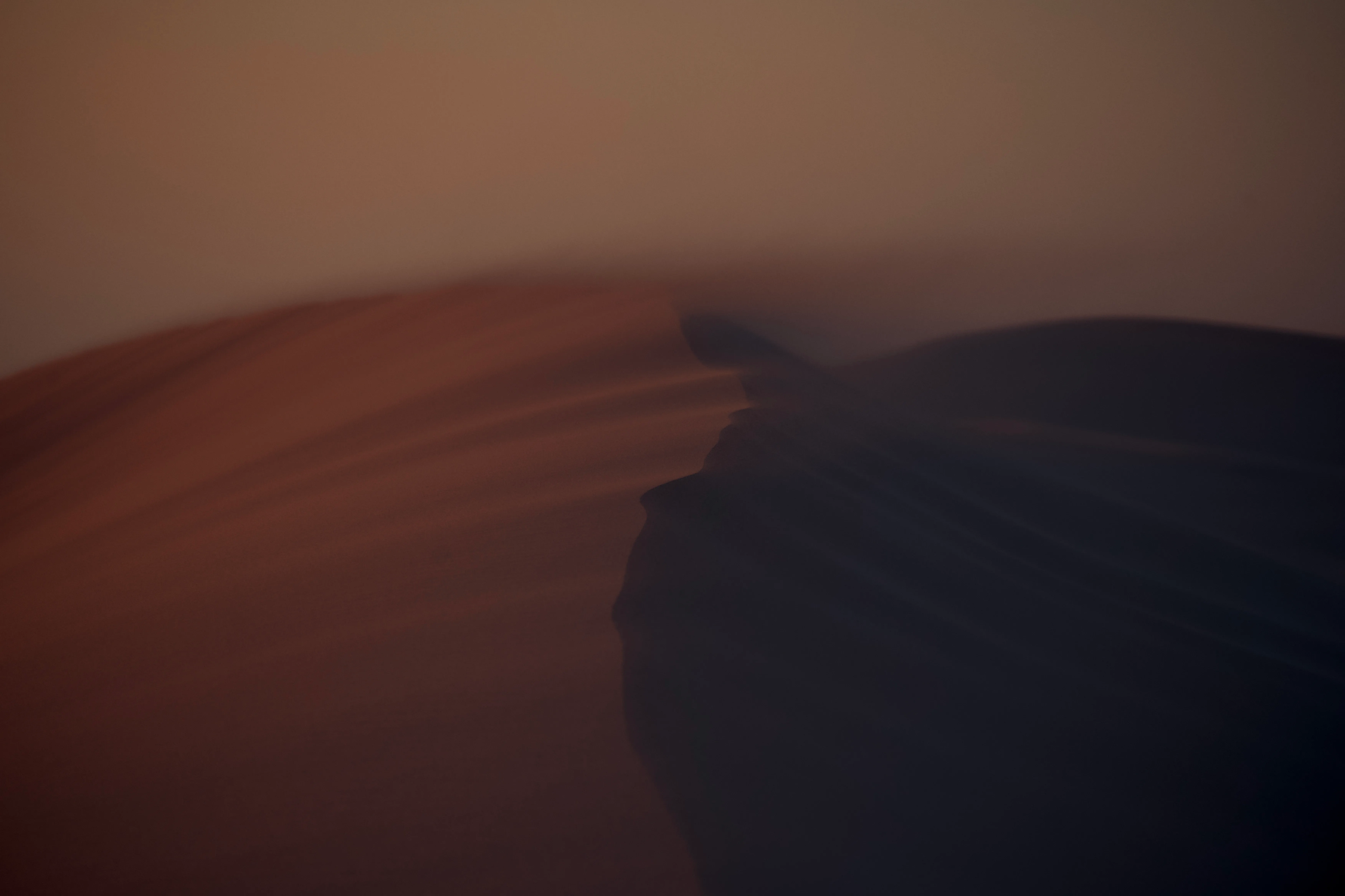 Few second exposure watching the sand roll over the top of a dune

